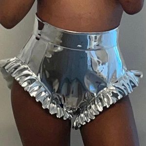 Metallic silver shorts with ruffles at the side